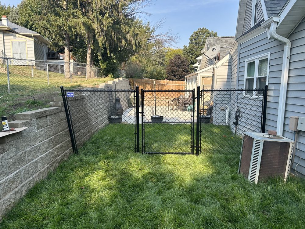 Chain link fence installed around a commercial building