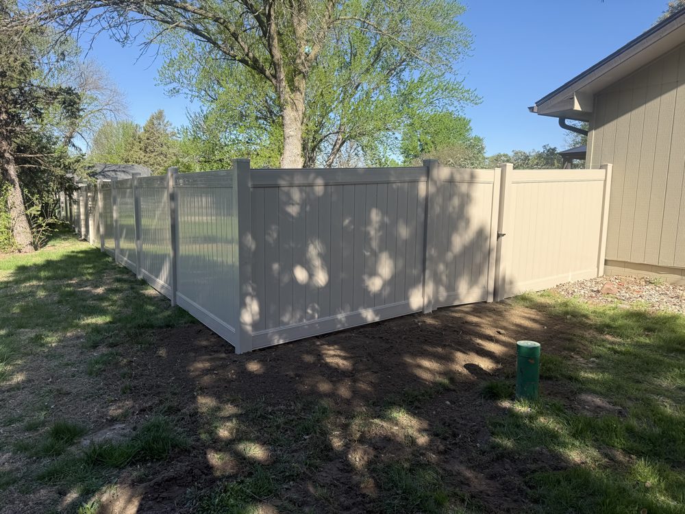 Chain link fence and gate installed at a commercial site