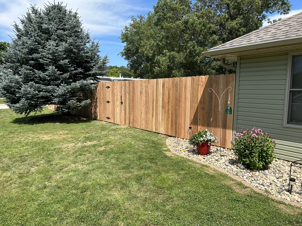 Ornamental aluminum fence installed around a patio area